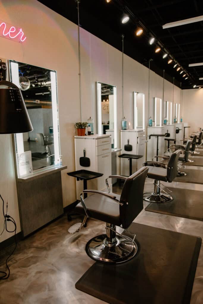 black salon chairs and mirrors in salon
