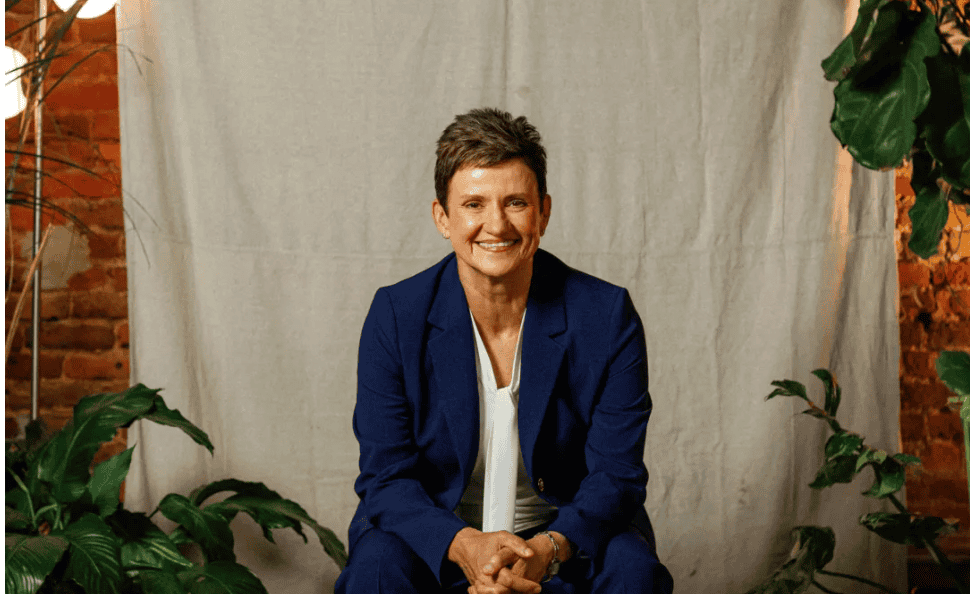 Woman smiling in professional attire for Upper Cumberland Lifestyle feature.