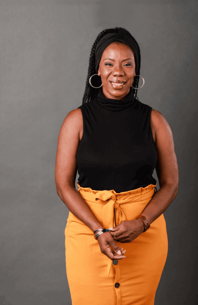 African American woman smiling in black sleeveless top for Upper Cumberland Lifestyle.