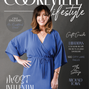 Woman in blue dress smiling, promoting Upper Cumberland lifestyle.