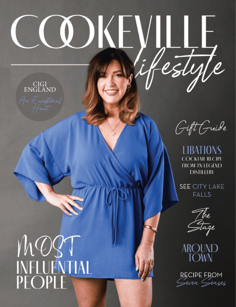 Woman in blue dress smiling, promoting Upper Cumberland lifestyle.