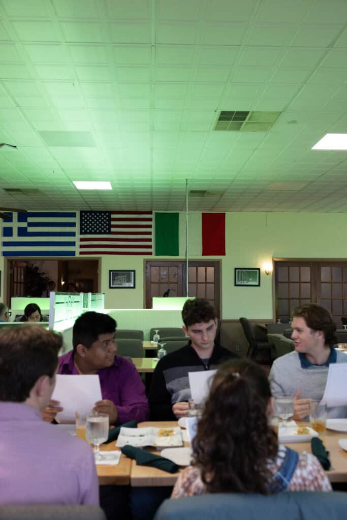 Group of diverse students studying together in a classroom.
