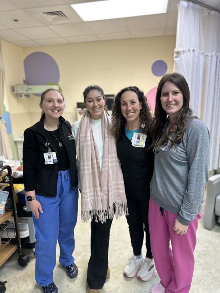nurses and doctors with new mom and baby at cookeville regional hospital after emergency delivery
